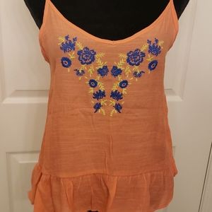 Tangerine tank with floral embroidery and ruffle